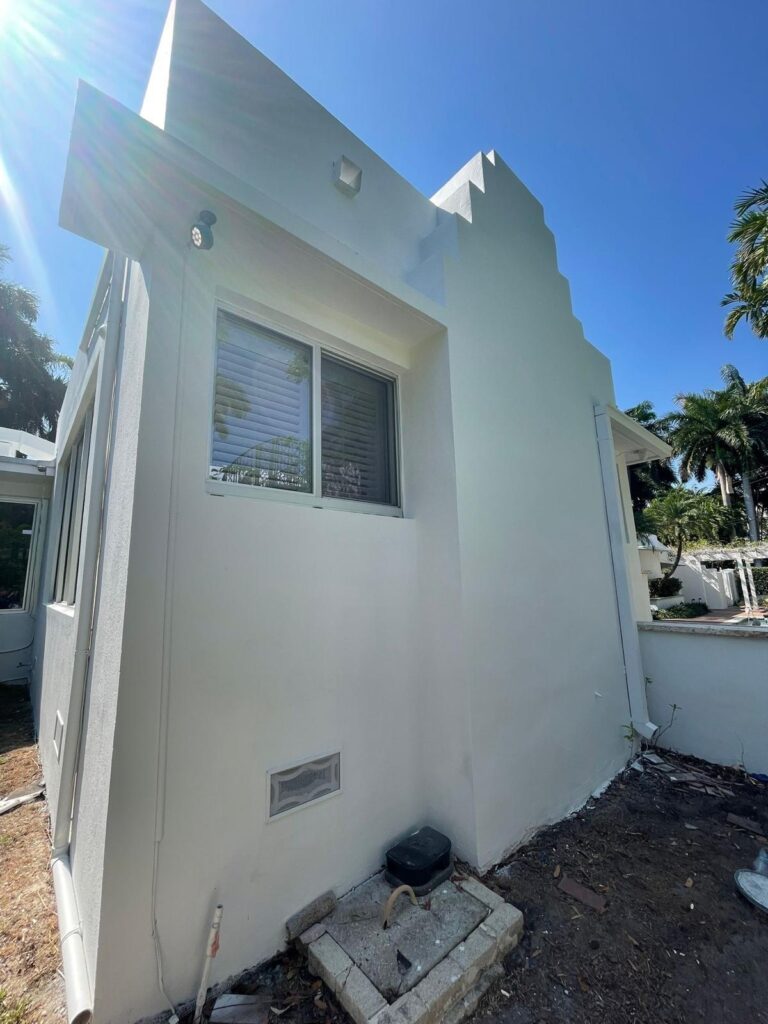 Same residential house exterior fully restored and spotless after professional pressure washing